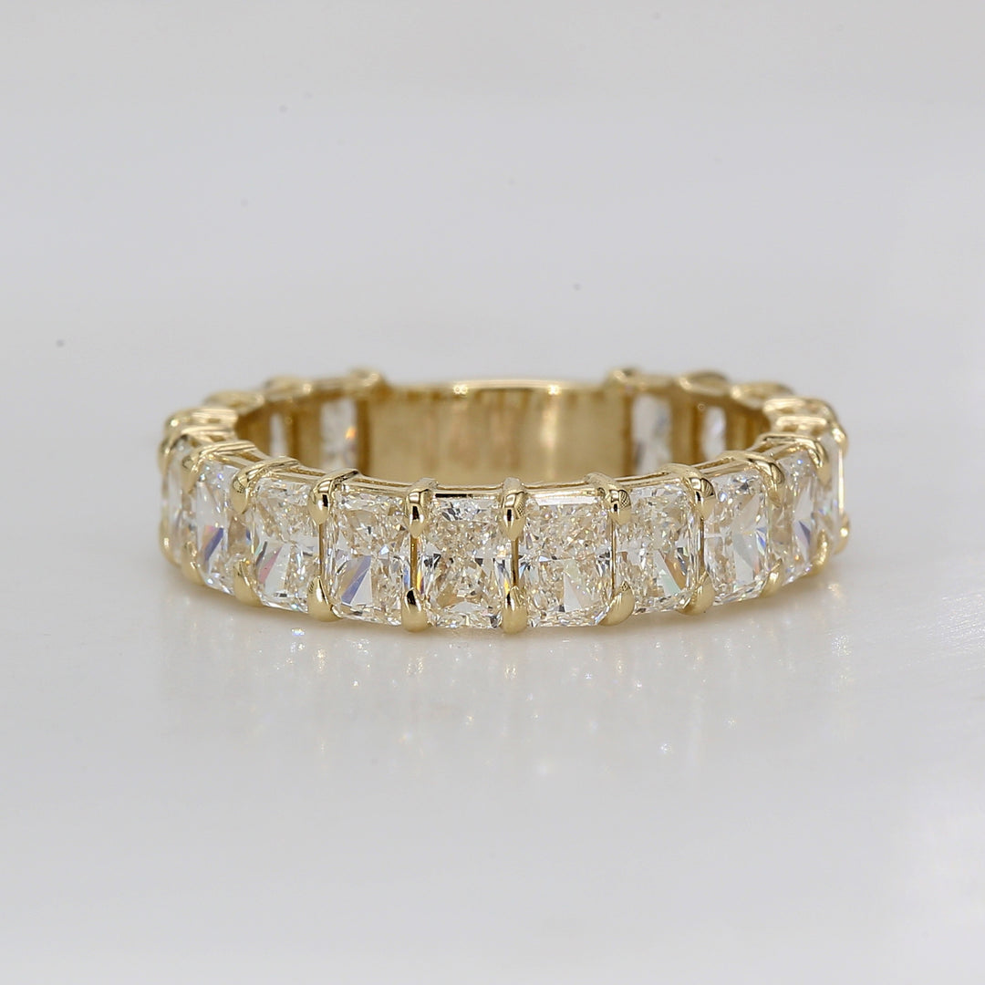 Band in 14K YG with double basket shared prong set (18) radiant diamonds. D2.63ct.t.w. Size 4