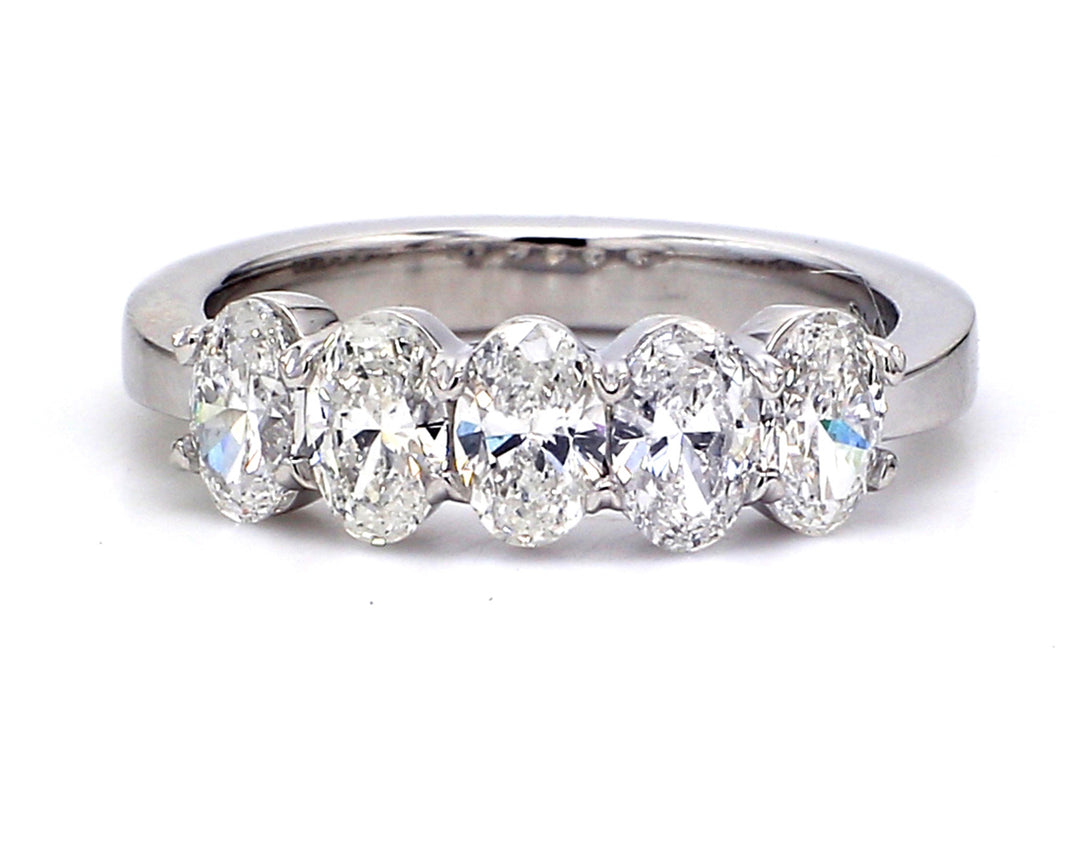 5-stone band in platinum with basket prong set oval cut diamonds. D1.40ct.t.w. Size 6