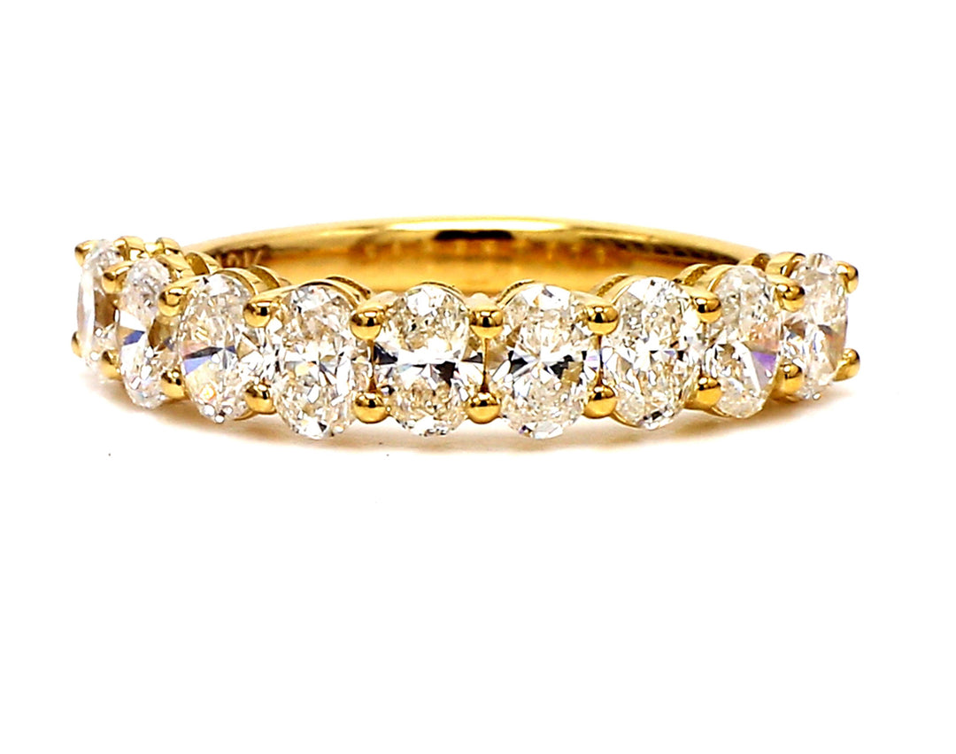 9-stone band in 18K YG with basket prong set oval cut diamonds. D1.69ct.t.w. Size 7.25