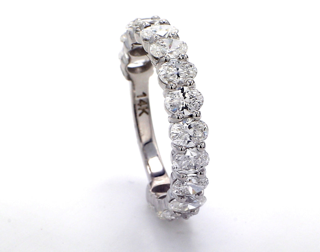 3/4 way band with basket prong set (15) oval cut diamonds. D2.06ct.t.w. Size 5.25