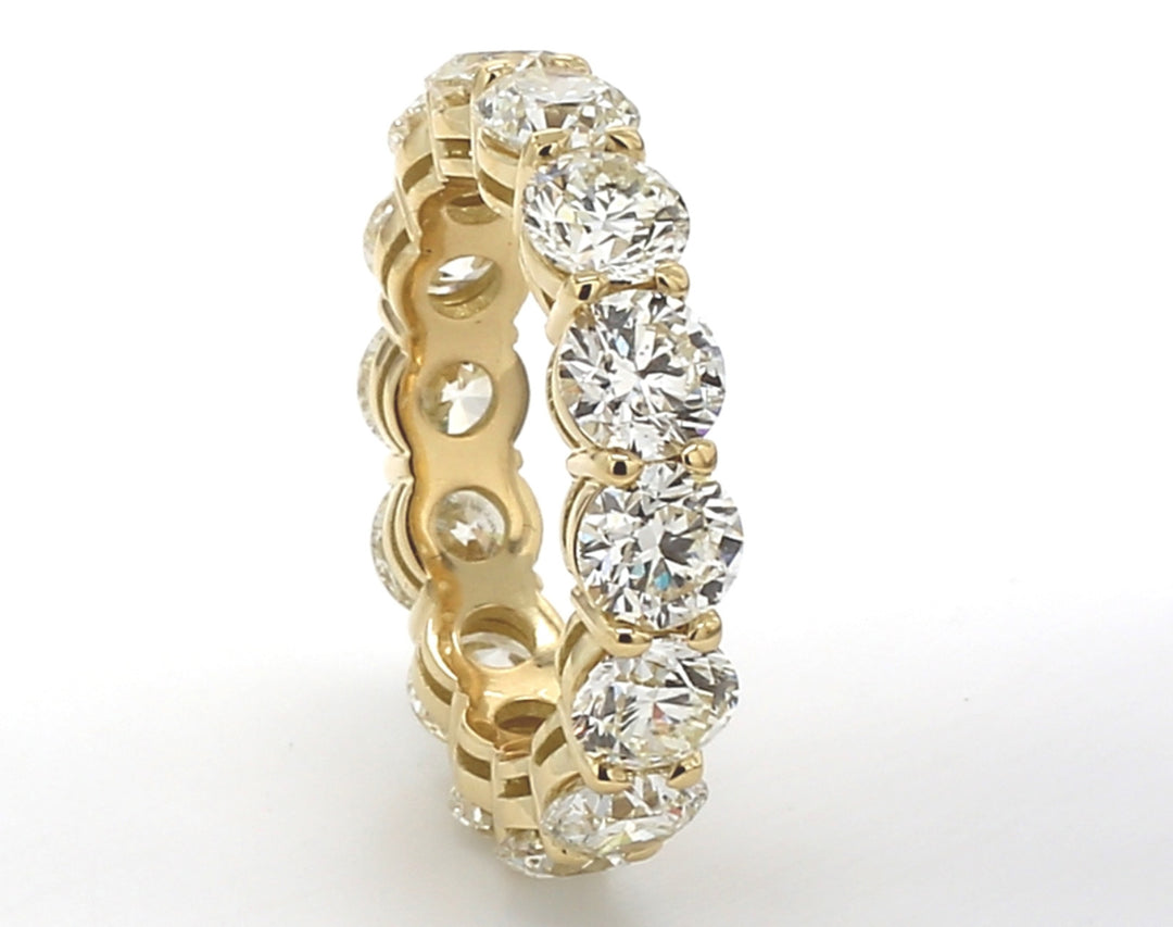 Eternity band in 18K YG with basket prong set round diamonds. D7.03ct.t.w. Size 7