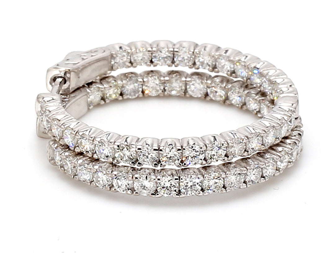 1"" Inside out hoop earrings with prong set (54) round diamonds. D2.69ct.t.w.