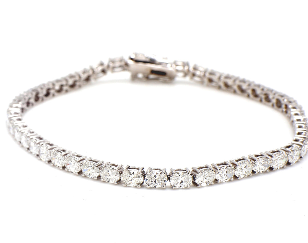 7"" Tennis bracelet east to west style with 4-prong set (46) oval diamonds. D6.42ct.t.w.