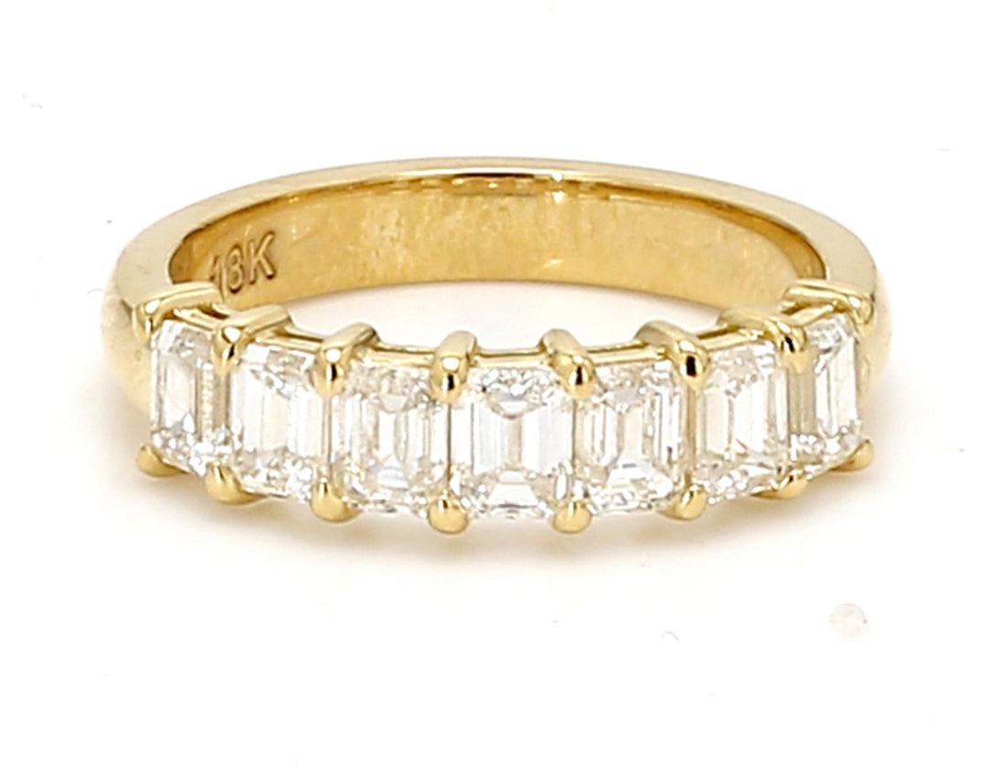 7-stone band in 18K YG with basket prong set emerald cut diamonds. D1.66ct.t.w. Size 5.75