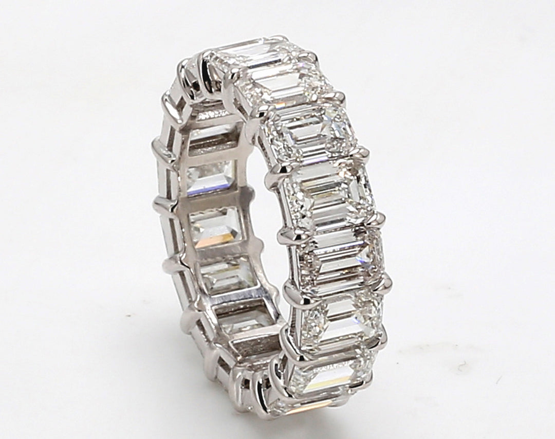Eternity band in platinum with basket claw prong set GIA certified E-G/IF-VS2 (17) emerald cut diamonds. D8.41ct.t.w. Size 6
