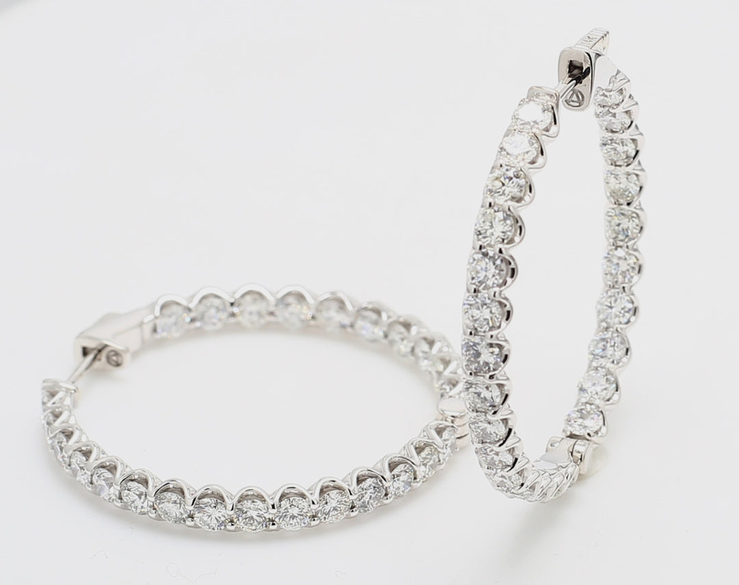 1.20"" Inside out hoop earrings with U-prong set (50) round diamonds. D5.25ct.t.w.
