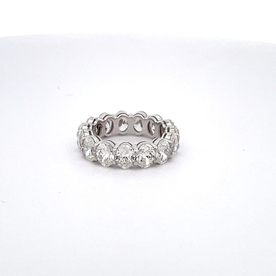 Eternity band in platinum with basket claw prong set GIA certified G-H/VS1-SI1 (15) oval cut diamonds. D6.02ct.t.w. Size 5.25