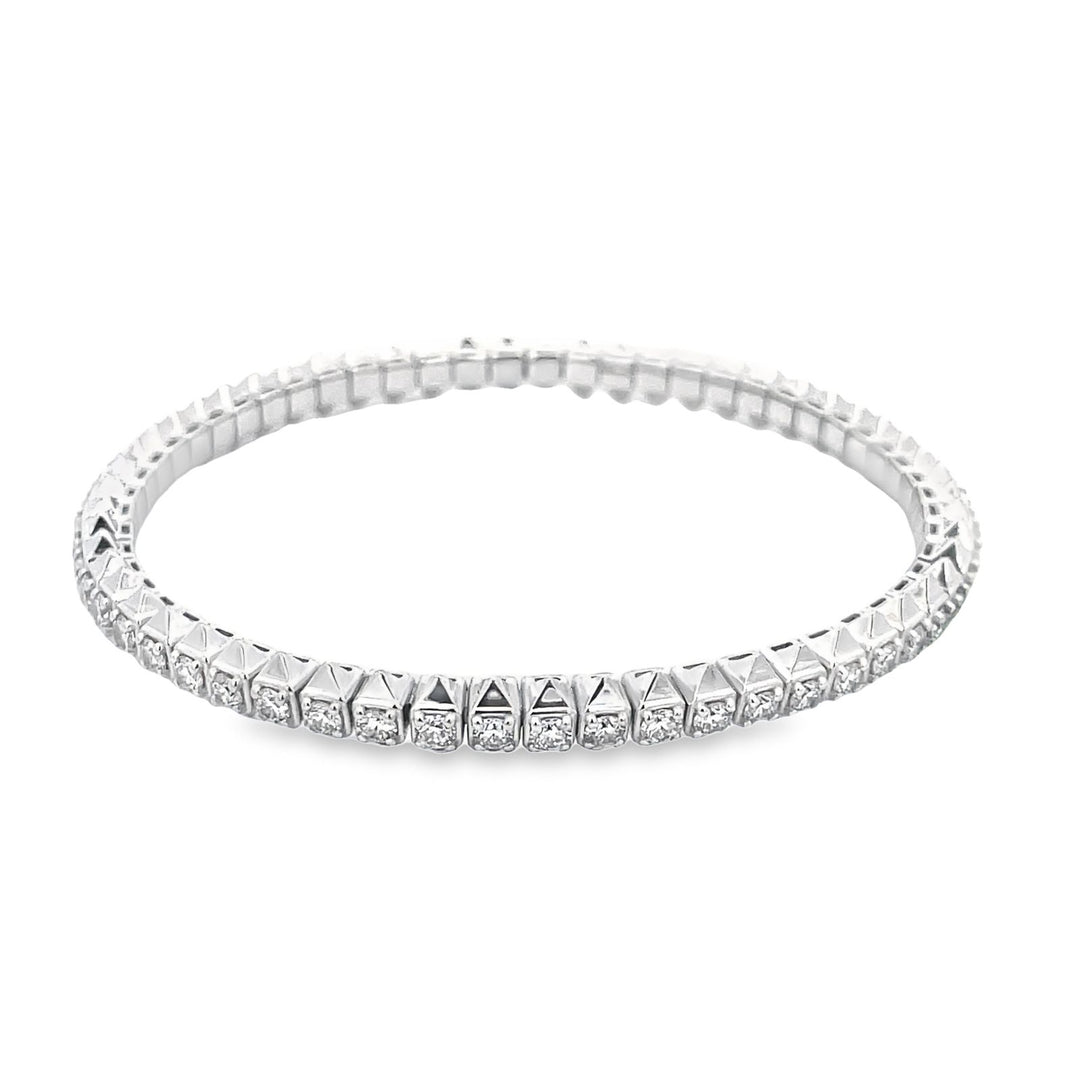 Flex tennis bangle in 18K WG with prong set round diamonds. D2.89ct.t.w.
