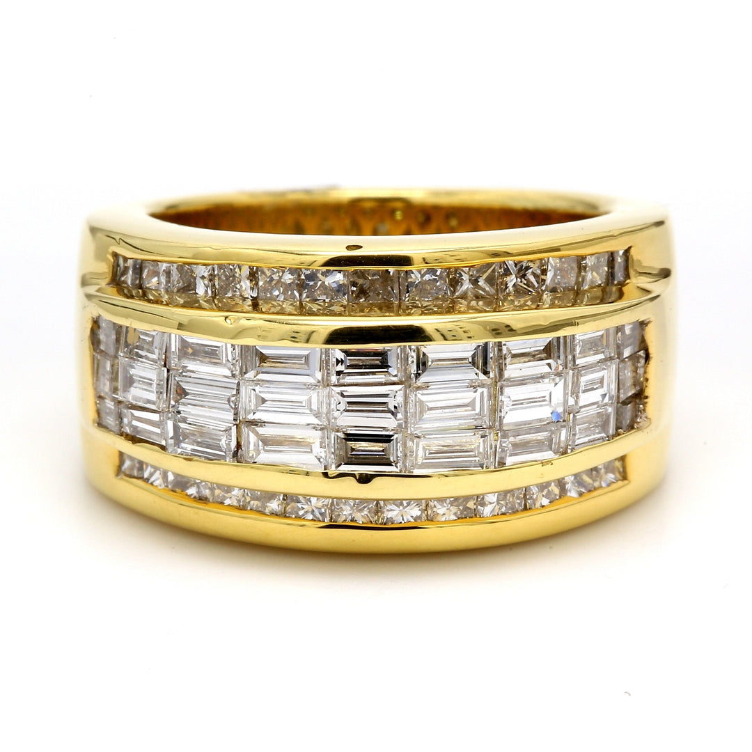 Band in 18K YG with 3-row baguettes & princess cut diamond on sides.  D2.75ct.t.w.