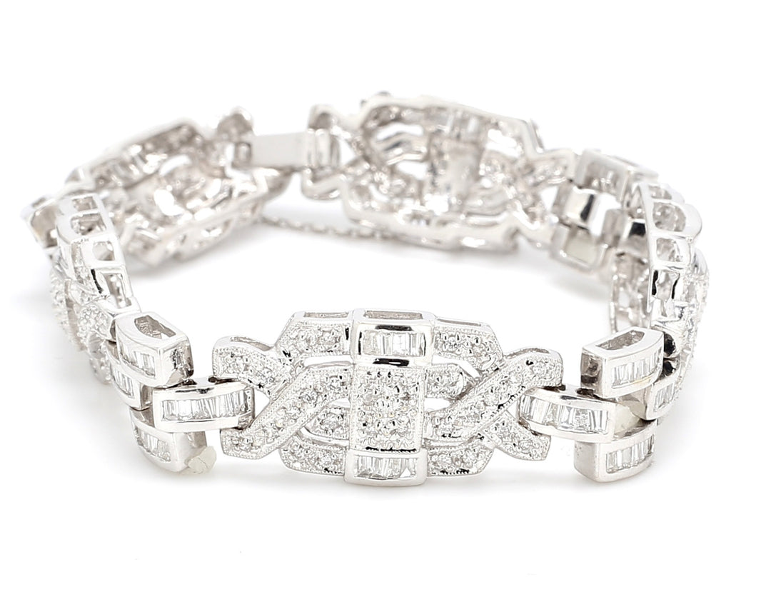 Antique style bracelet in 18K WG with round & baguette diamonds.  D4.30ct.t.w.