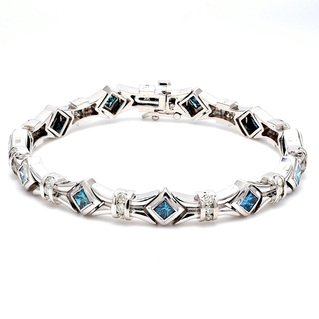 Bracelet with round diamonds & princess cut blue diamonds.  D1.35ct.t.w.  Blue diamonds 2.83ct.t.w.