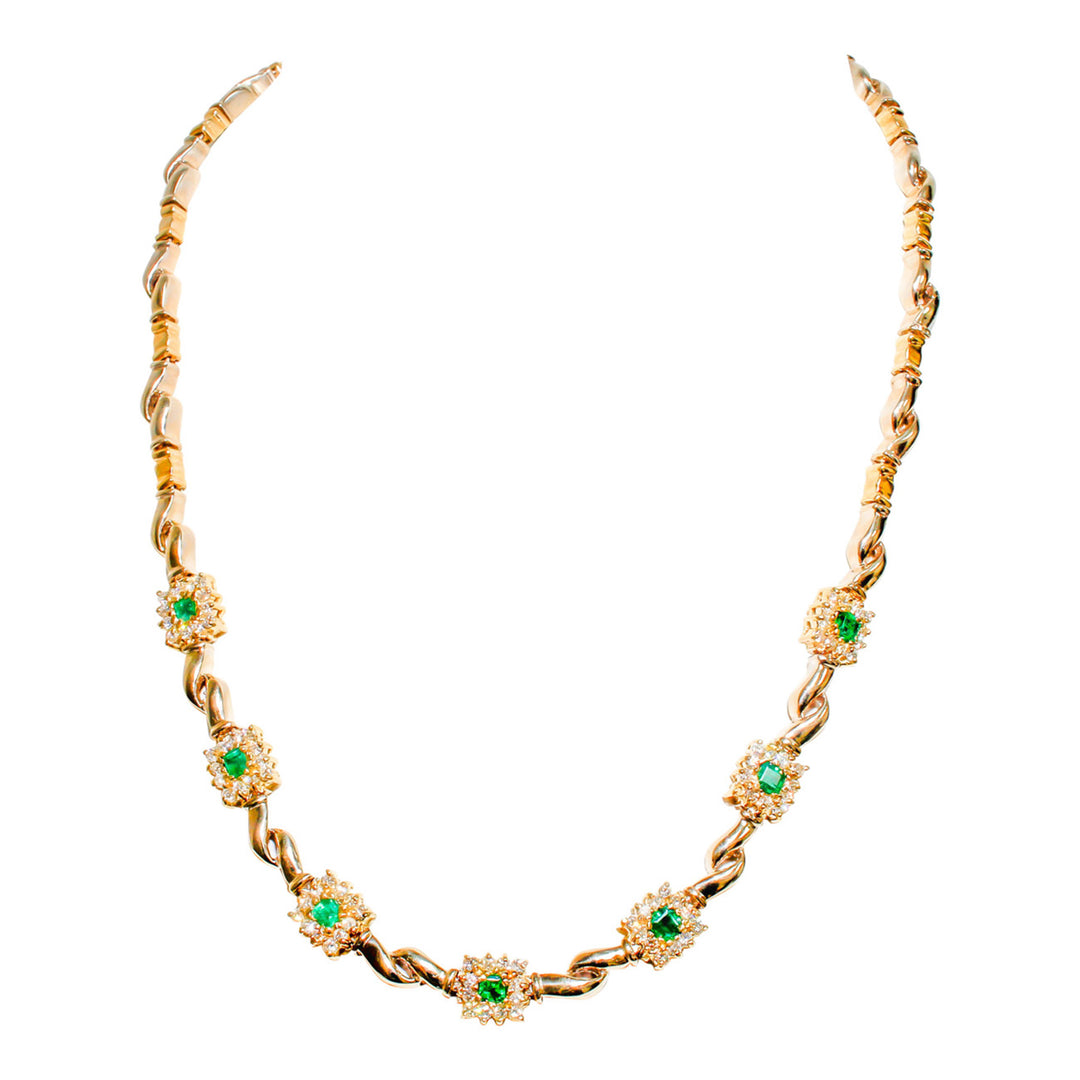 Halo necklace with prong set round diamonds around emeralds.  D1.75ct.t.w.  Emerald 1.25ct.t.w.