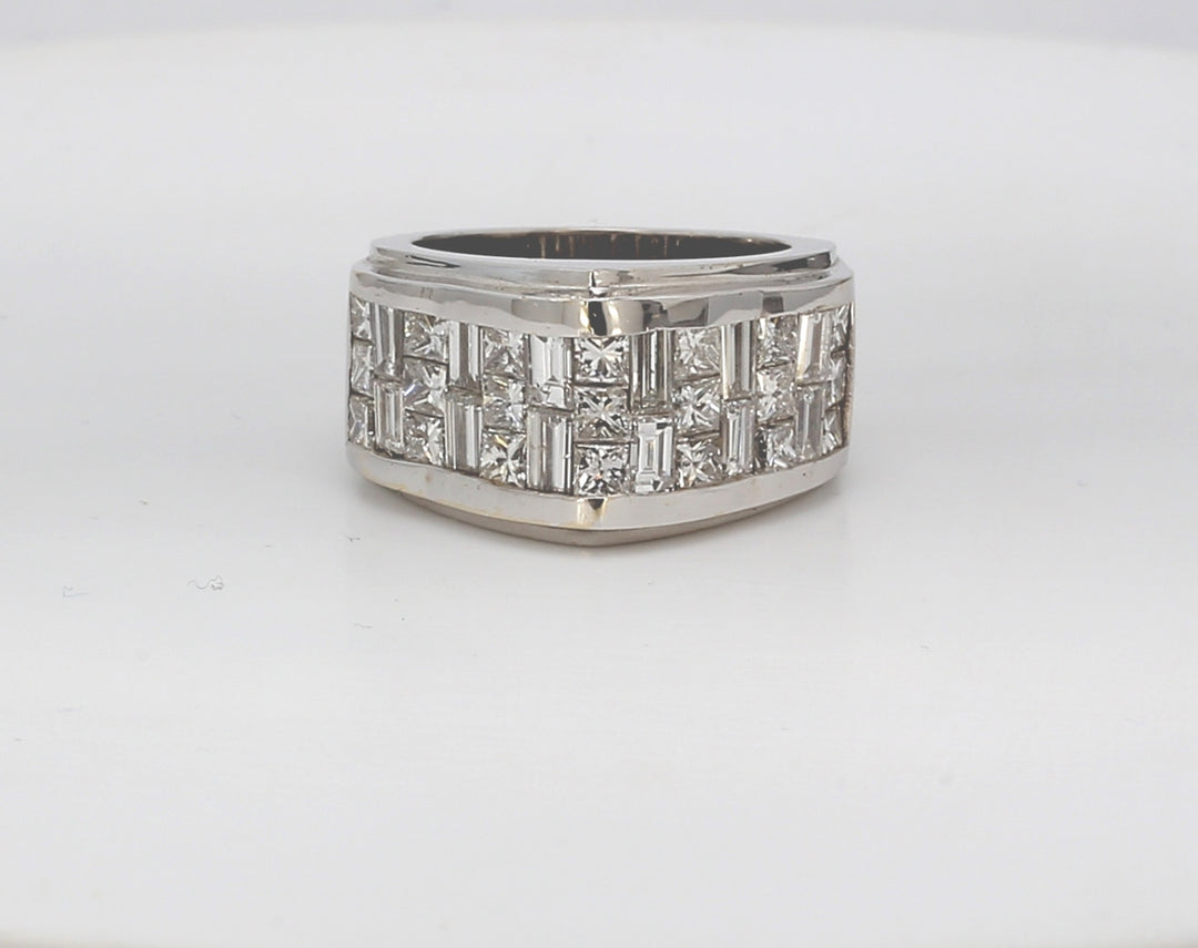 Pointed top band with 3-row invisible set princess cut and baguette diamonds.  D3.80ct.t.w.