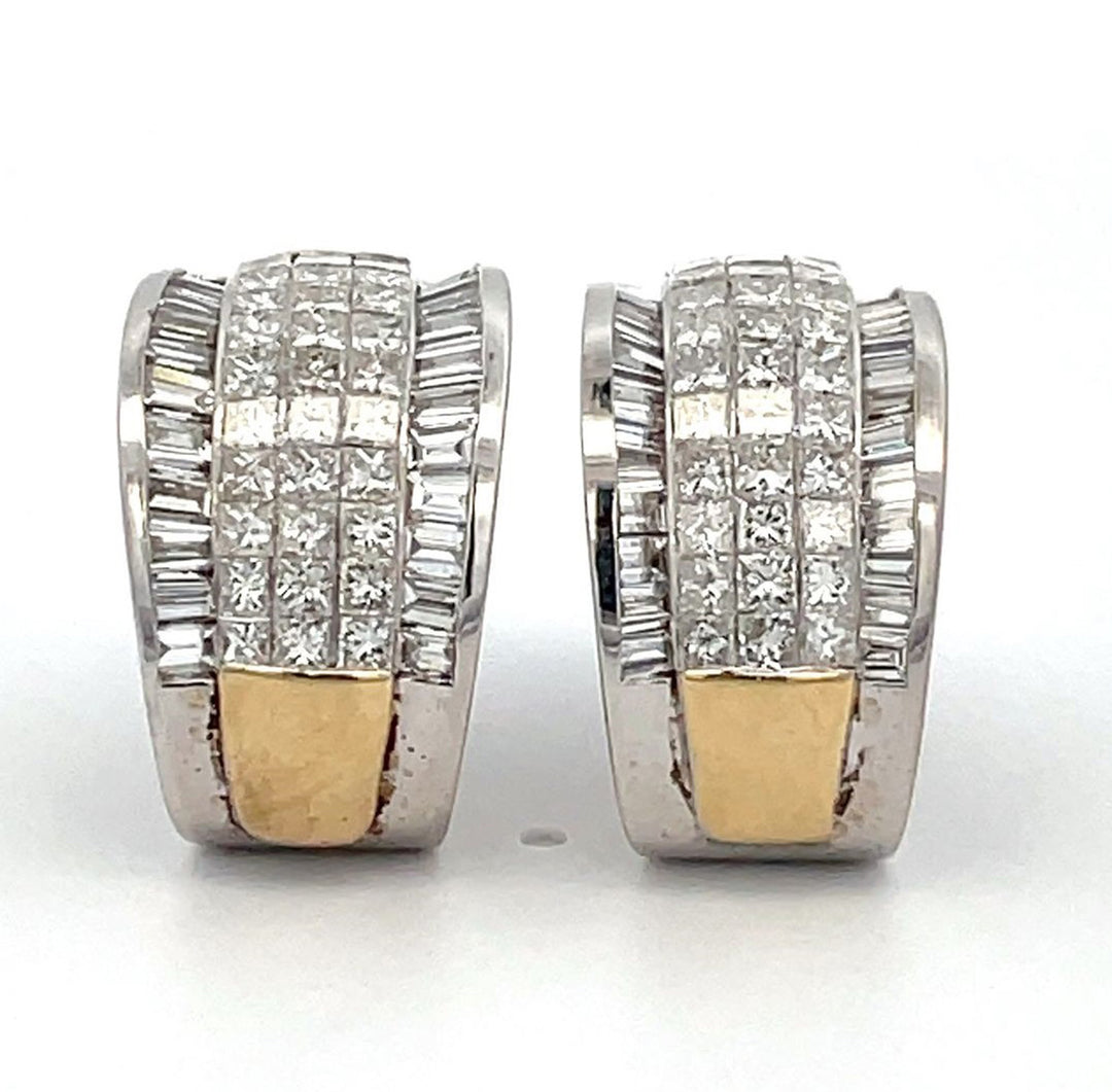 French clip earrings in 2-tone with raised 3-row invisible set princess cuts and channel set baguette diamonds.  D5.50ct.t.w.