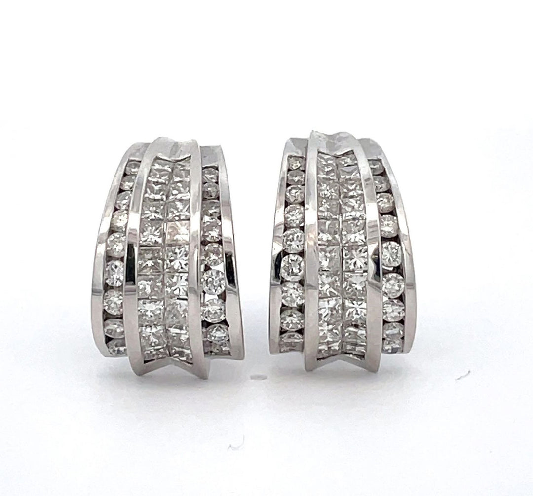 French clip earrings with channel set rounds & 2-row invisible set princess cut diamonds.  D4.30ct.t.w.