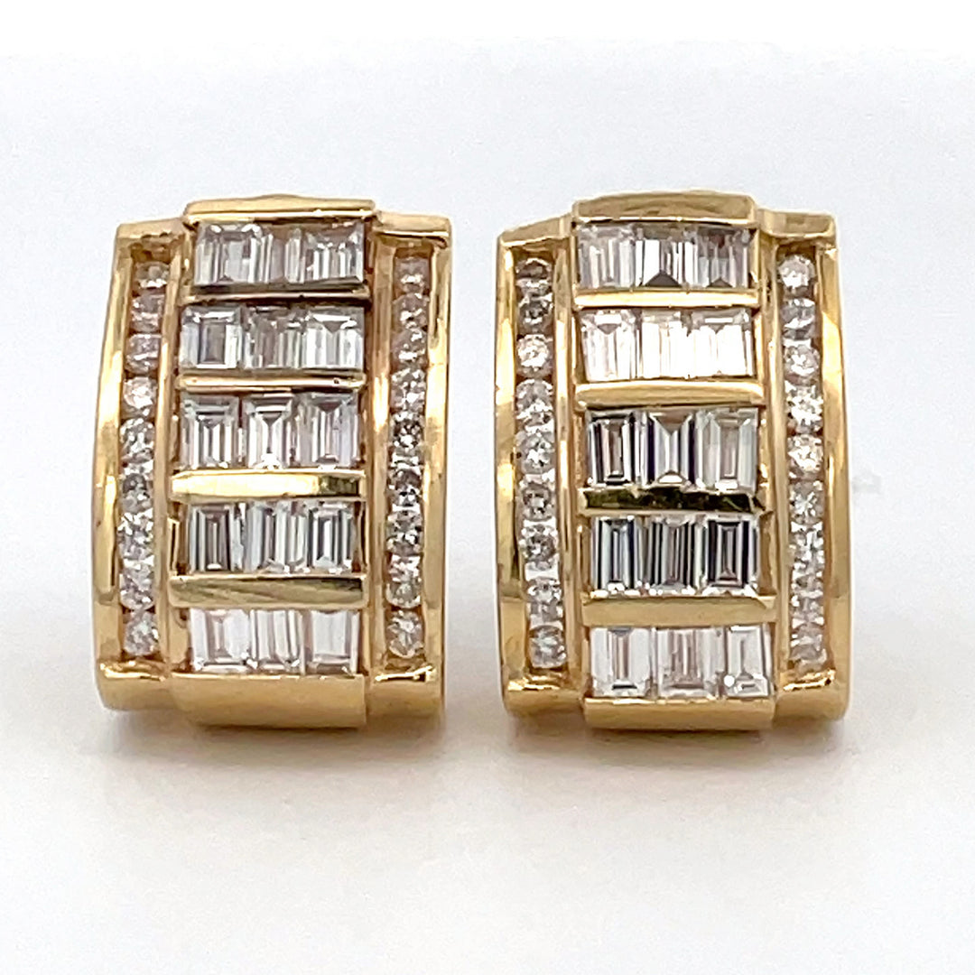 French clip earrings in yellow gold with channel set round and baguette diamonds.  D4.50ct.t.w.
