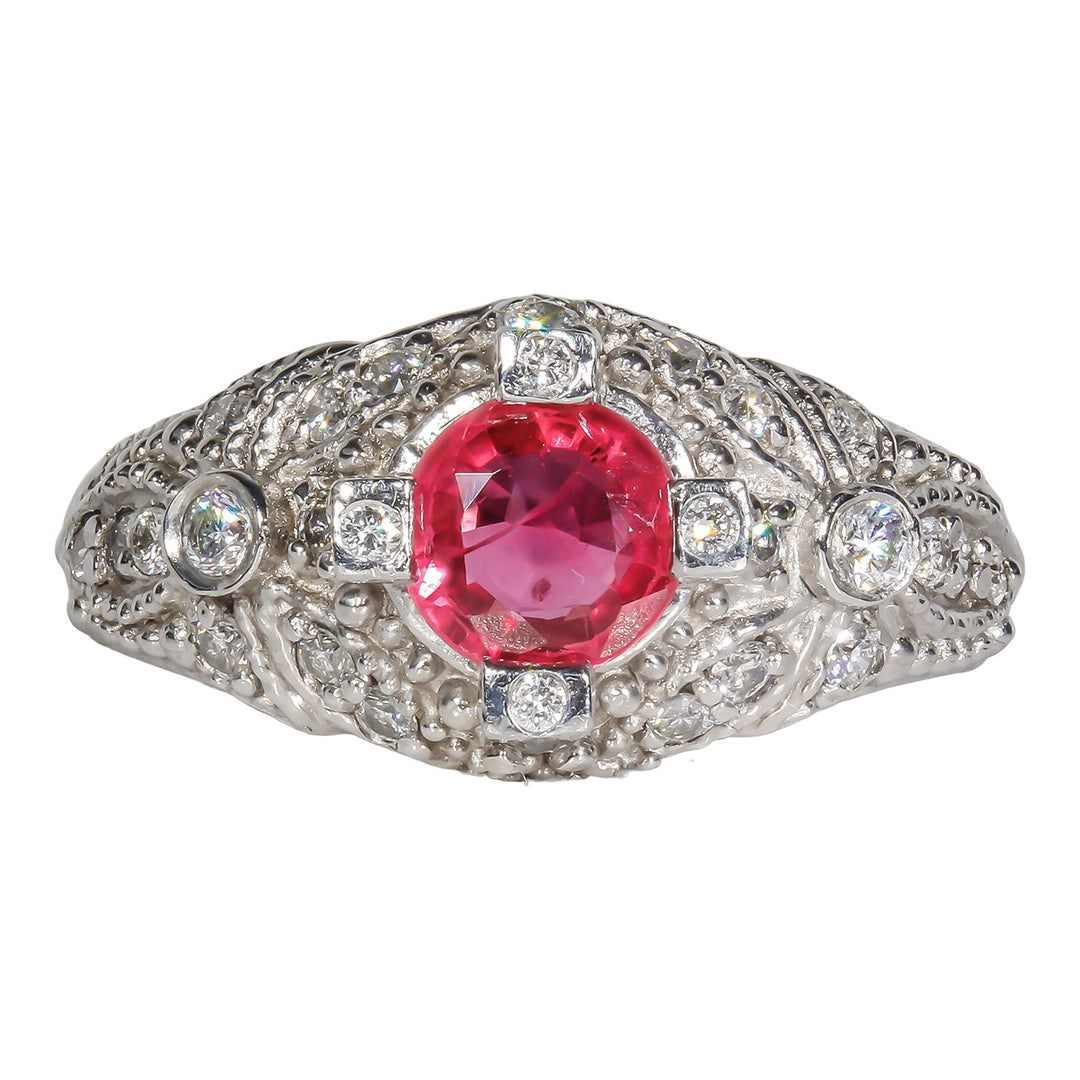 Antique style ring in platinum with round diamonds & round shaped Ruby center.  D0.37ct.t.w.  Ruby 1.06ct