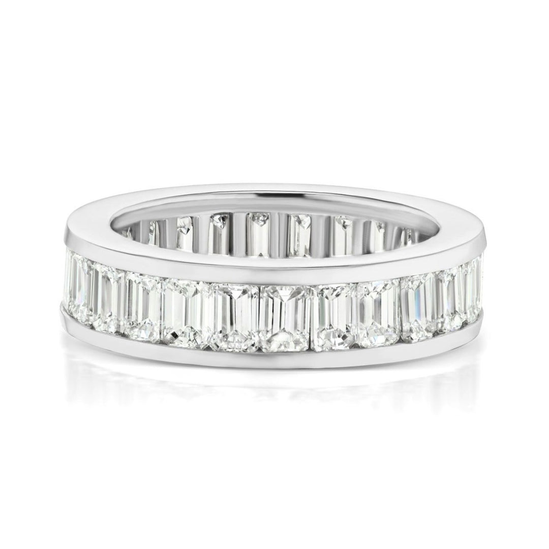 Eternity band with (26) emerald cut diamonds.  D3.98ct.t.w.
