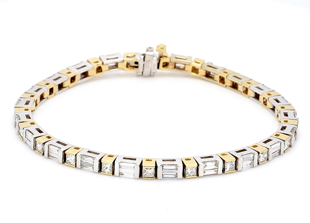Tennis bracelet in two-tone with alternating princess cut & baguette diamonds.  D3.65ct.t.w.