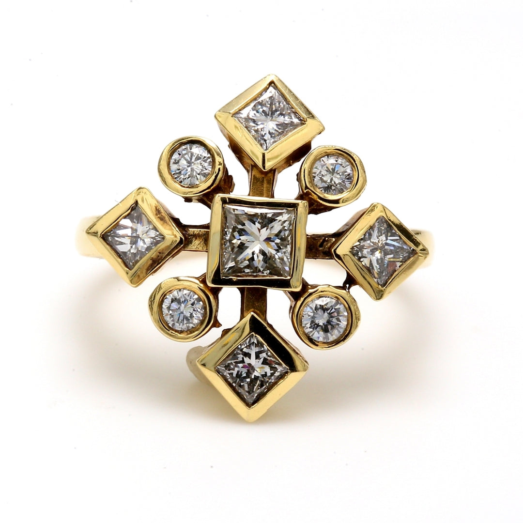 Right hand ring in YG with round & princess cut diamonds.  D1.17ct.t.w.