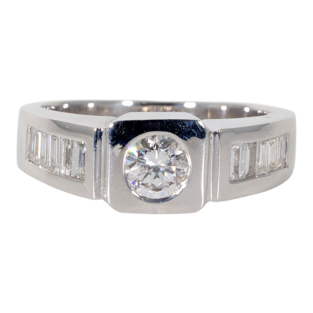 Flat top ring with channel set baguettes on shank and bezel set round diamond center stone.  D0.92ct.t.w.