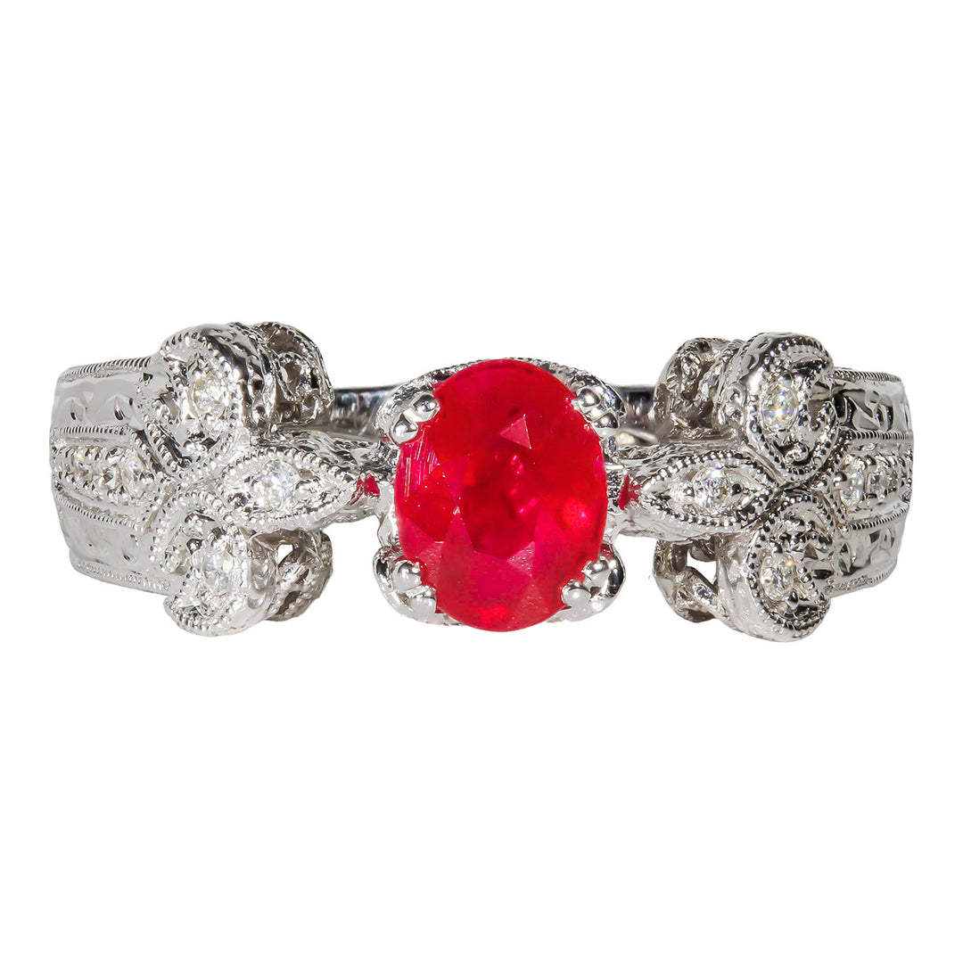 Ring with flower design in 18K WG with round diamonds & Ruby center.  D0.30ct.t.w.  Ruby 1.16ct.