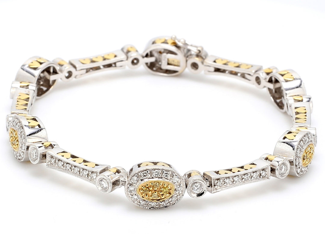 Bracelet in 18K two-tone with round white & yellow diamonds.  D2.33ct.t.w.