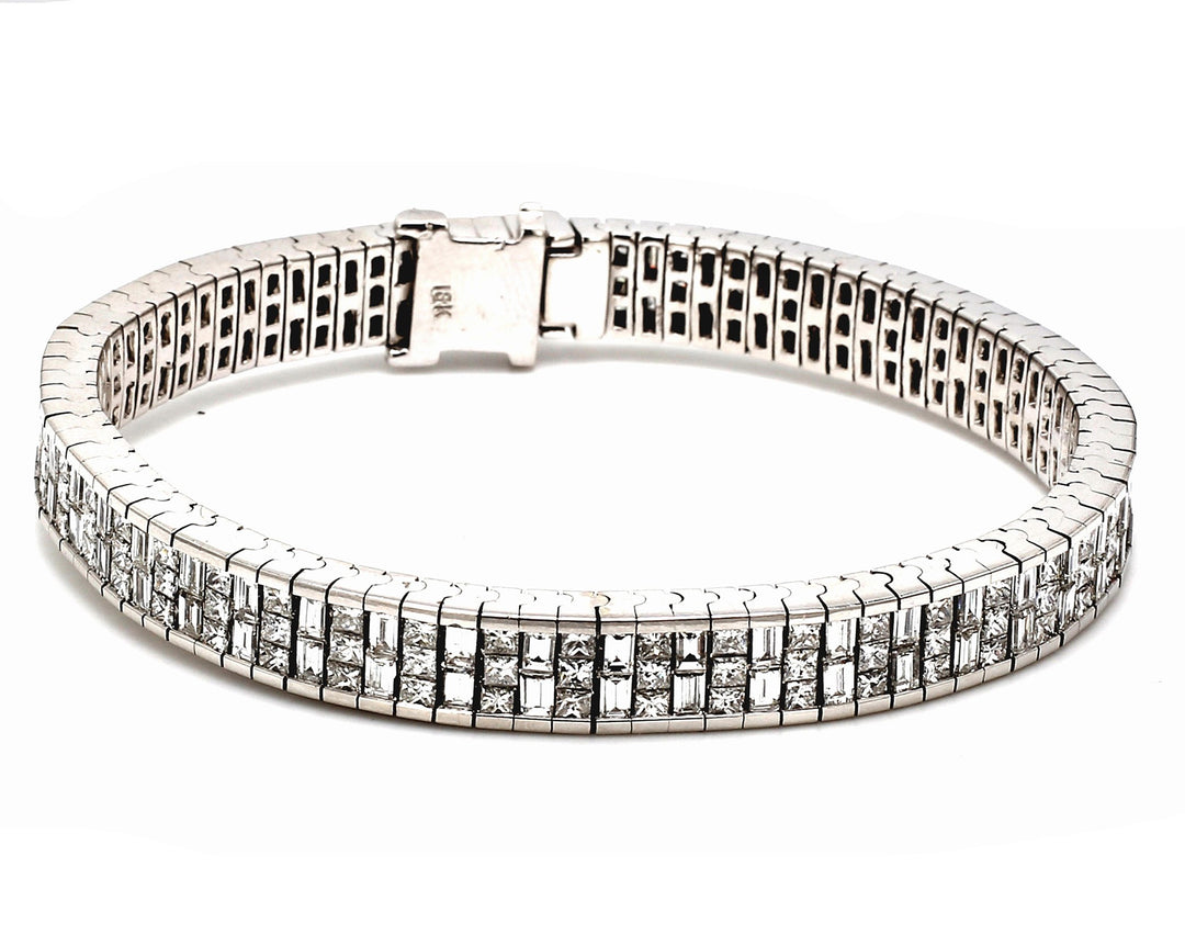 Bracelet in 18K WG w/ invisible set combination of 3-row princess cuts & 2-row baguette diamonds.  D10.91ct.t.w.