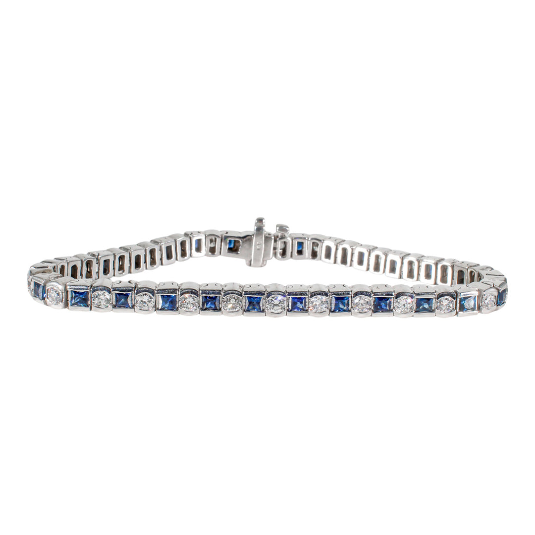 7"" Tennis bracelet in white gold with alternating round diamonds & princess cut sapphires.  D2.35ct.t.w.  Sapphires 3.35ct.t.w.
