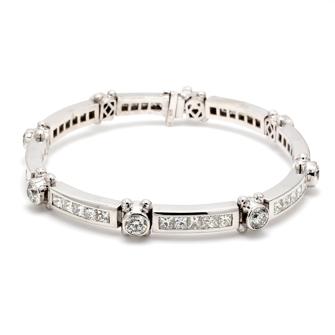 8"" Link bracelet with alternating bezel set rounds & channel set princess cut diamonds.  D12.11ct.t.w.