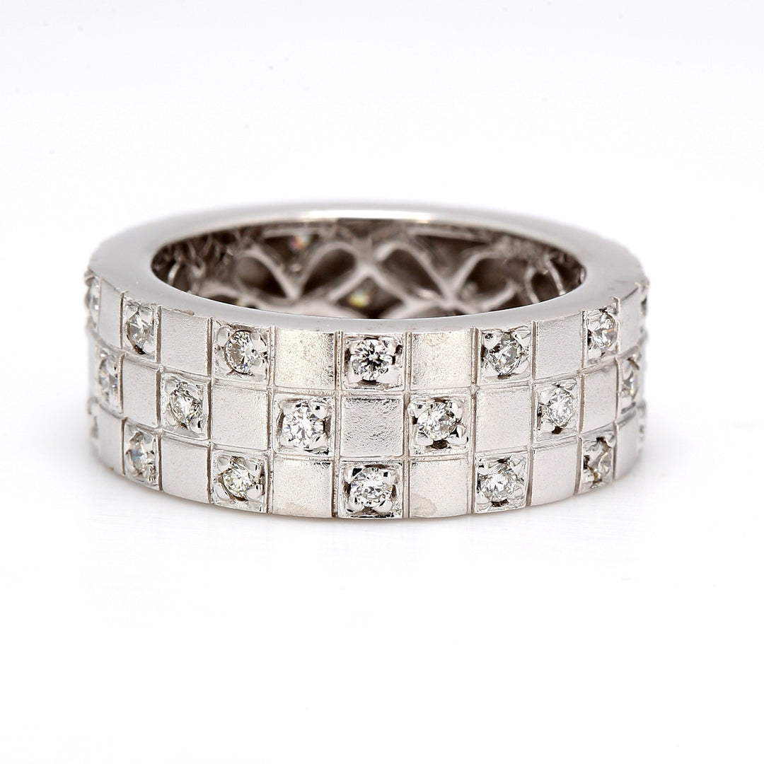 Eternity band brush finished with round diamonds.  D0.75ct.t.w.