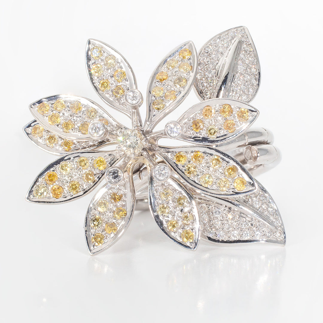 Folded style flower ring with bezel and pave set round diamonds.  D1.56ct.t.w.