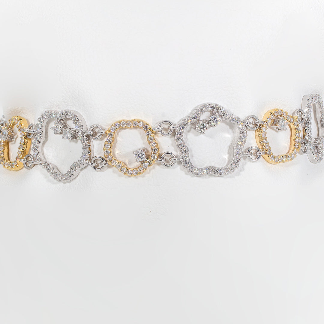 Star shaped link bracelet in 18K two-tone with prong set round diamonds.  D2.77ct.t.w.
