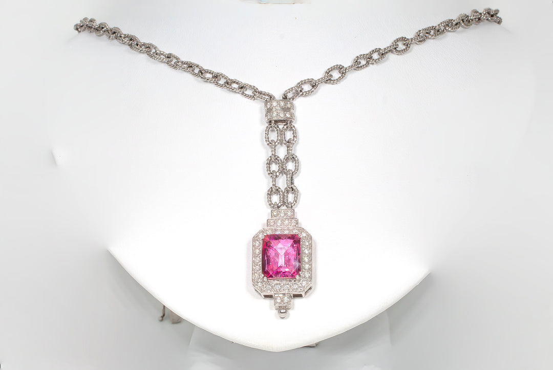 Necklace with pave set round diamonds and prong set pink topaz center stone.  D0.45ct.t.w.  Topaz 8.00ct.