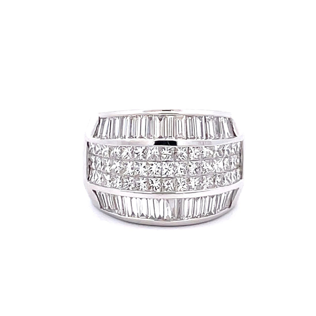 Wide band with 3-row invisible set princess cuts & channel set baguette diamonds on the sides.  D3.40ct.t.w.