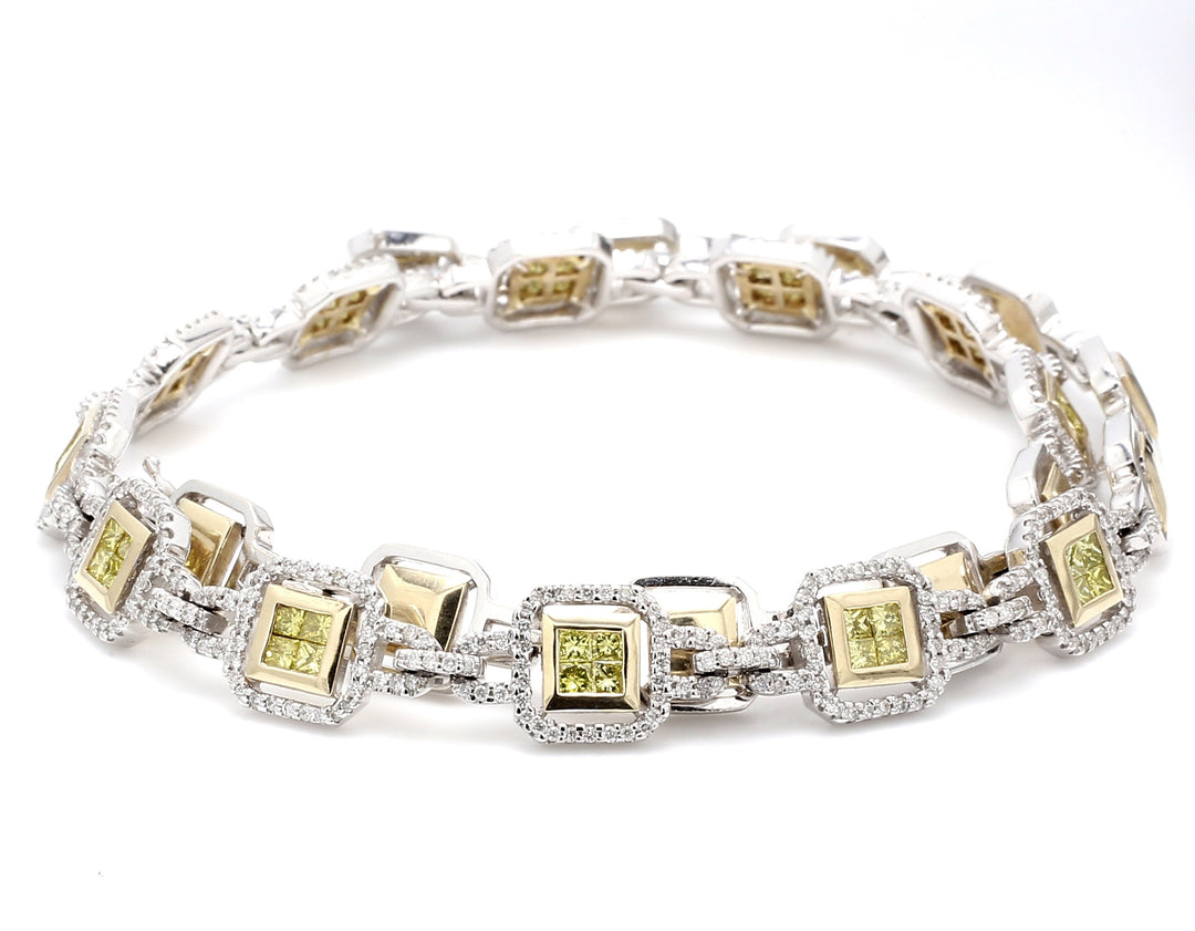 Necklace in 2-tone with rounds & 12 links of 2x2 princess cut fancy yellow diamonds.  D6.05ct.t.w.