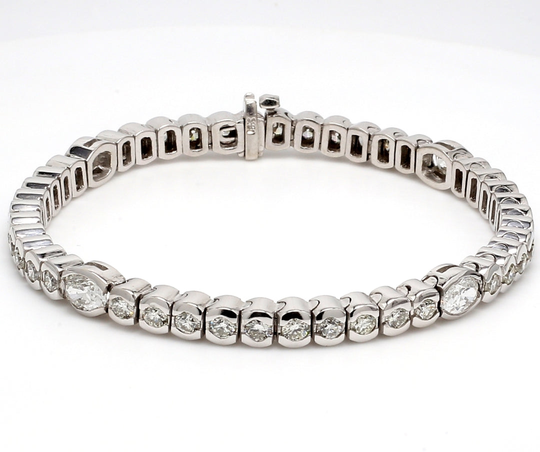 7"" Tennis bracelet with round & oval cut diamonds.  D5.86ct.t.w.