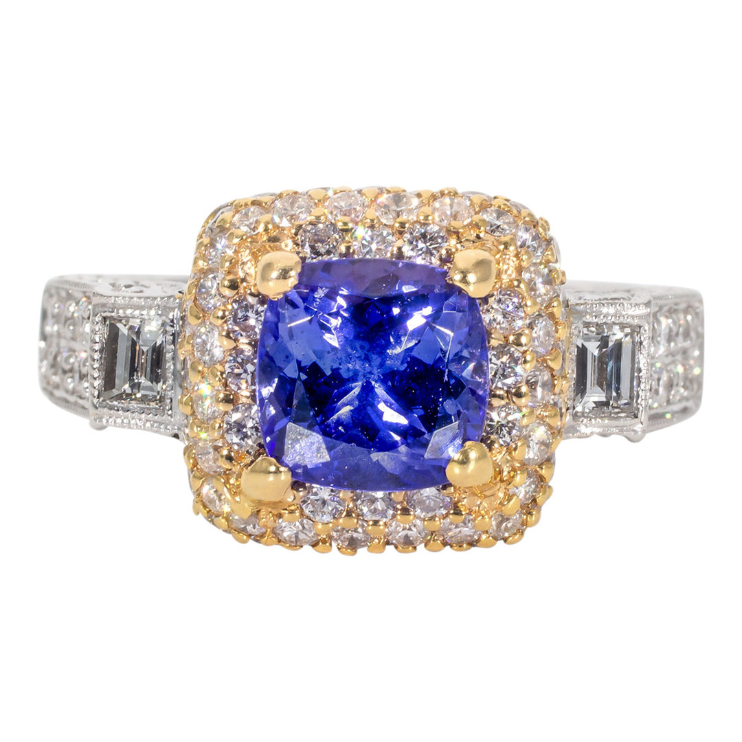 Halo ring in 18K 2-tone with rounds and baguette diamonds, & tanzanite center.  D1.55ct.t.w.  Tanzanite 1.99ct.