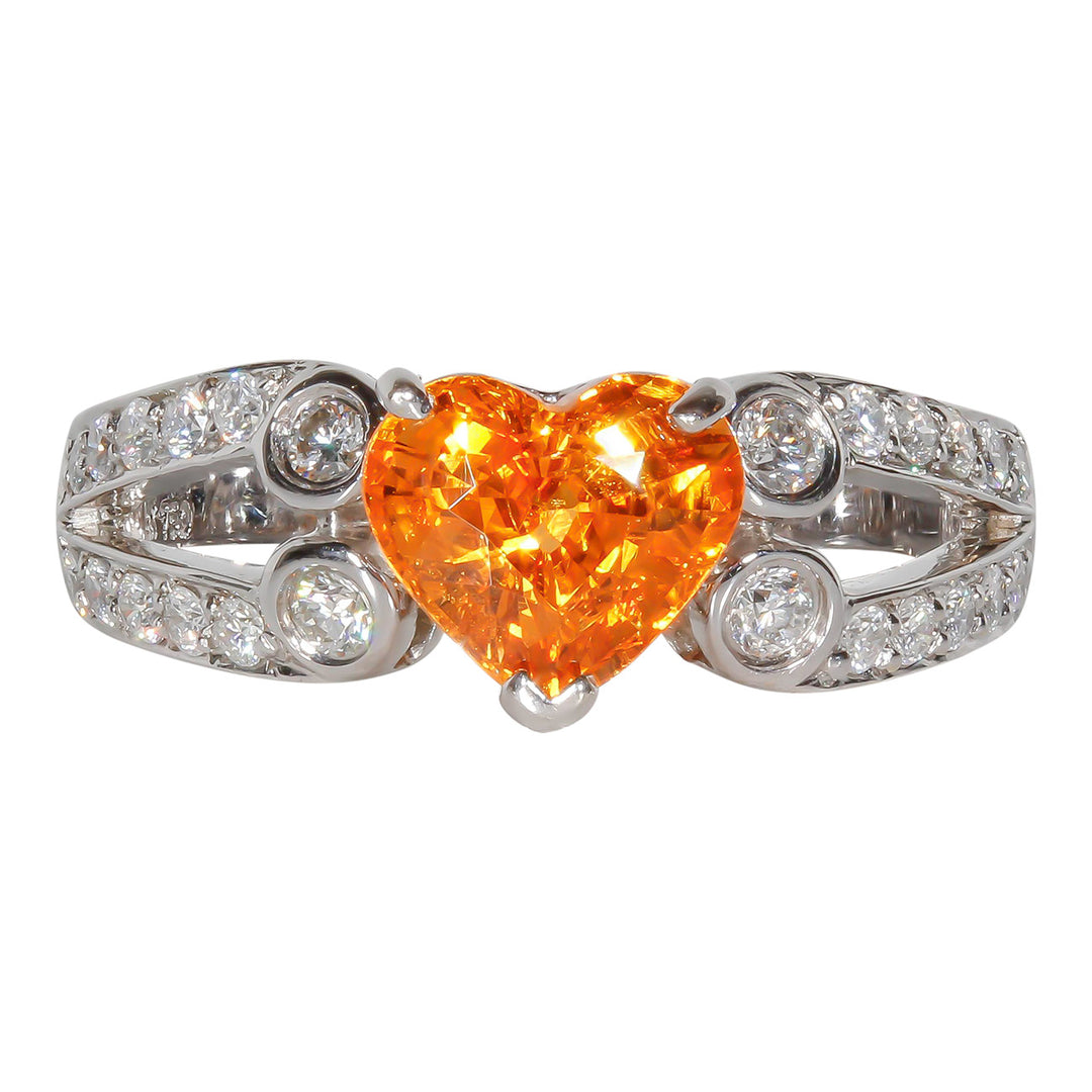 Split shank ring in 18K WG with pave and bezel set round diamonds and prong set heart shaped spessartite center stone.  D0.40ct.t.w.  Spessartite 2.20ct.