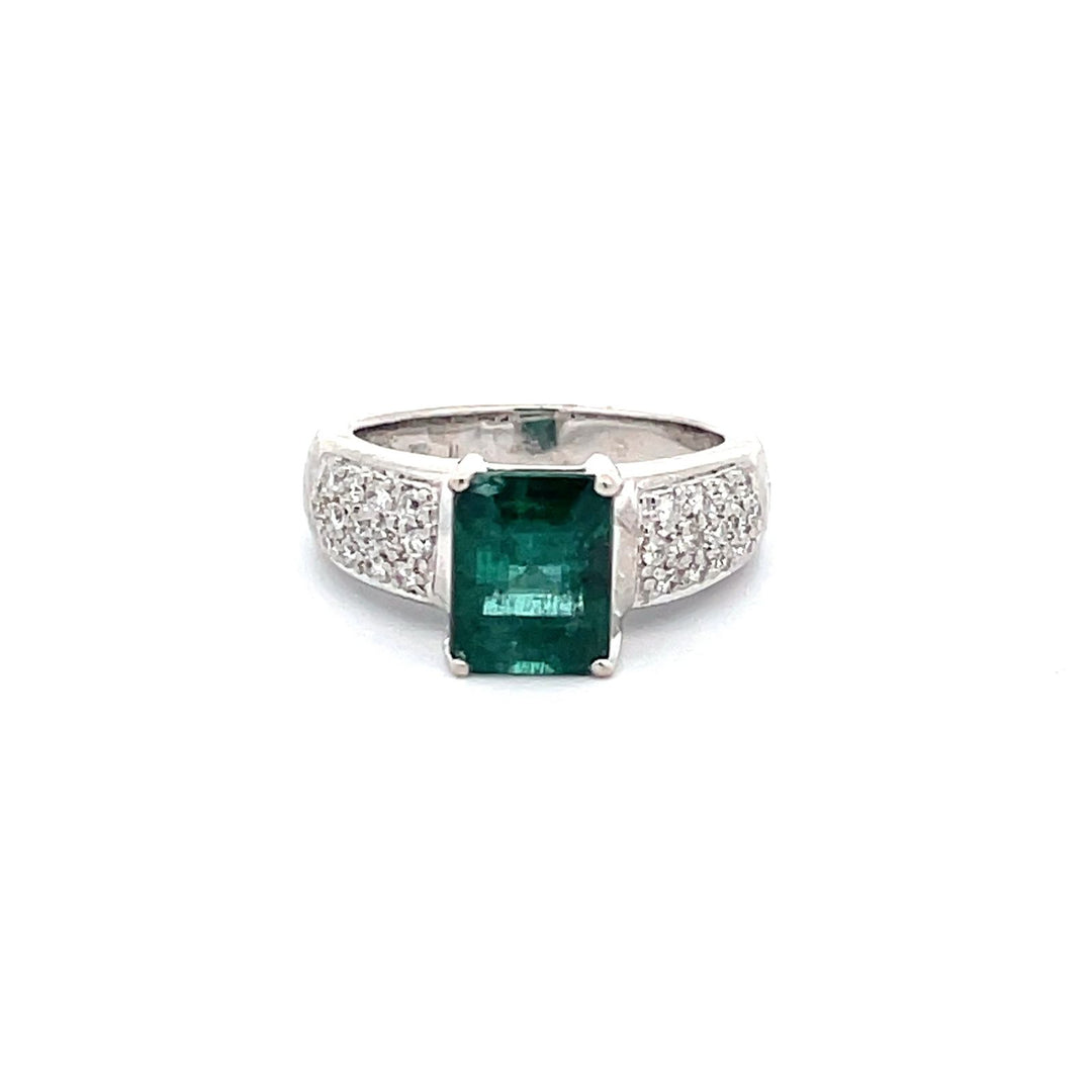 Ring in 18K WG with pave set round diamonds and 4-prong set emerald center.  D0.35ct.t.w.  (Emerald - 2.70ct.)