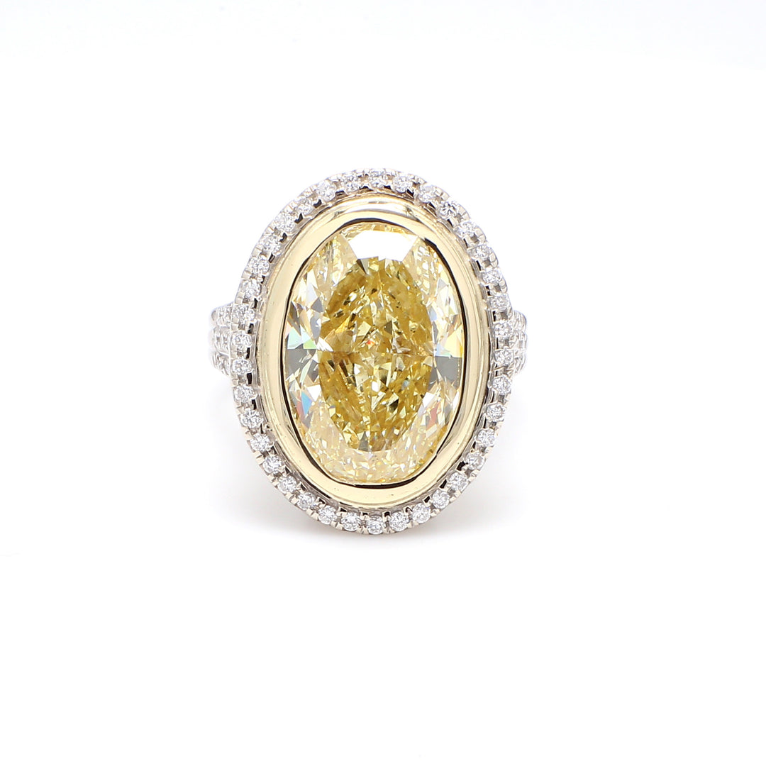 Halo ring in 18K WG with FLY/SI1 GIA oval center & round diamonds.  D11.21ct.t.w. (Center 10.01ct.)