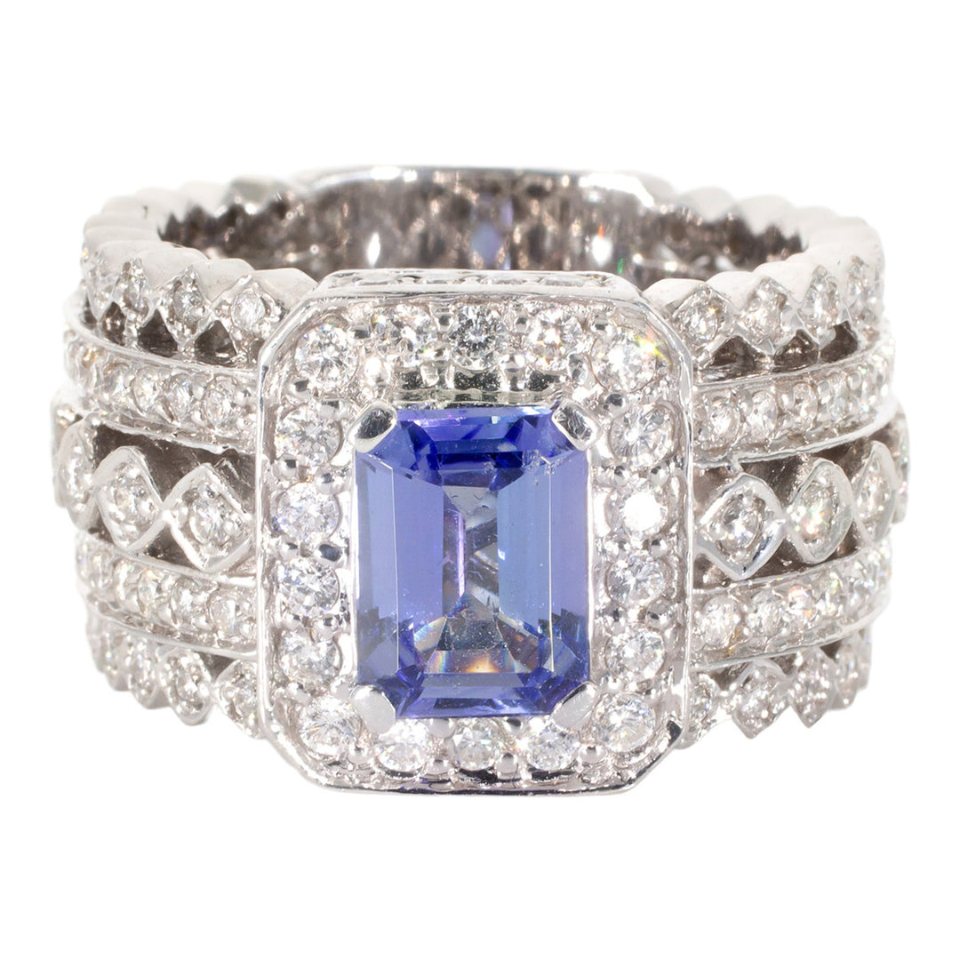 Wide halo ring in 18K WG with pre-set round diamonds and 4-prong set tanzanite center stone.  D1.75ct.t.w.  Tanzanite 1.40ct.