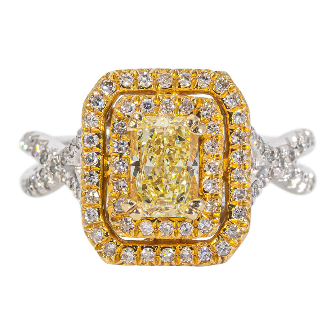 Double halo criss-cross shank ring in 14K two-tone with french pave set rounds and a 4-prong set FY radiant cut diamond center stone.  D1.19ct.t.w.  (Center 0.75ct.)