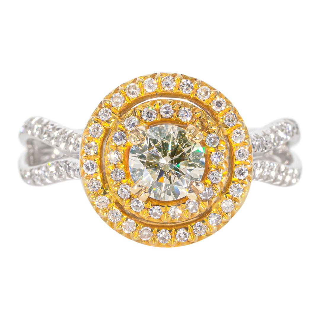 Double halo split-shank ring in 14K two-tone with french pave set rounds and a double 4-prong set round diamond center stone.  D0.94ct.t.w.  (Center 0.50ct.)
