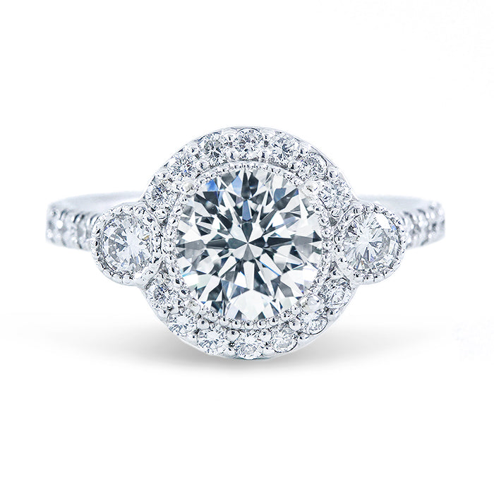 Halo 3-stone semi-mount with round diamonds & milgrain detail.  D0.66ct.t.w.