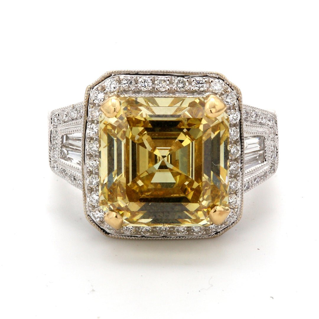 Halo ring in 18K WG with pave set rounds, baguettes, milgrain detail, and GIA certified FDBY/SI1 asscher cut diamond center.  D9.22ct.t.w.  (Center 8.09ct.)  Size 6