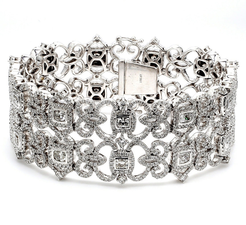 7.5"" Designer halo bracelet in 18K WG with bezel set cushions & french pave set round diamonds.  D11.97ct.t.w.