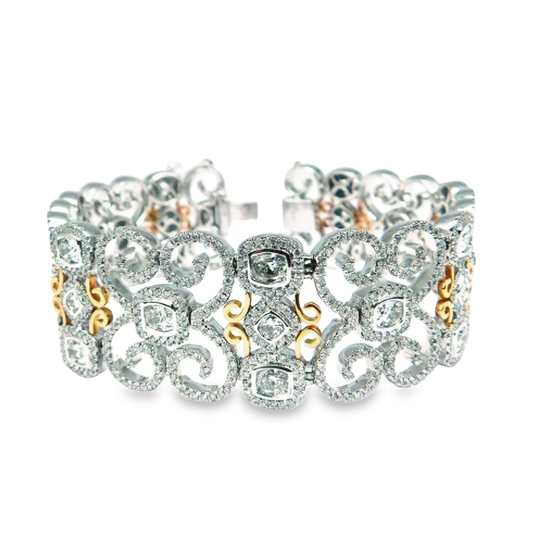 7.5"" Designer bracelet in 18K two-tone with French pave set rounds around bezel set cushion cut diamonds.  D10.81ct.t.w.