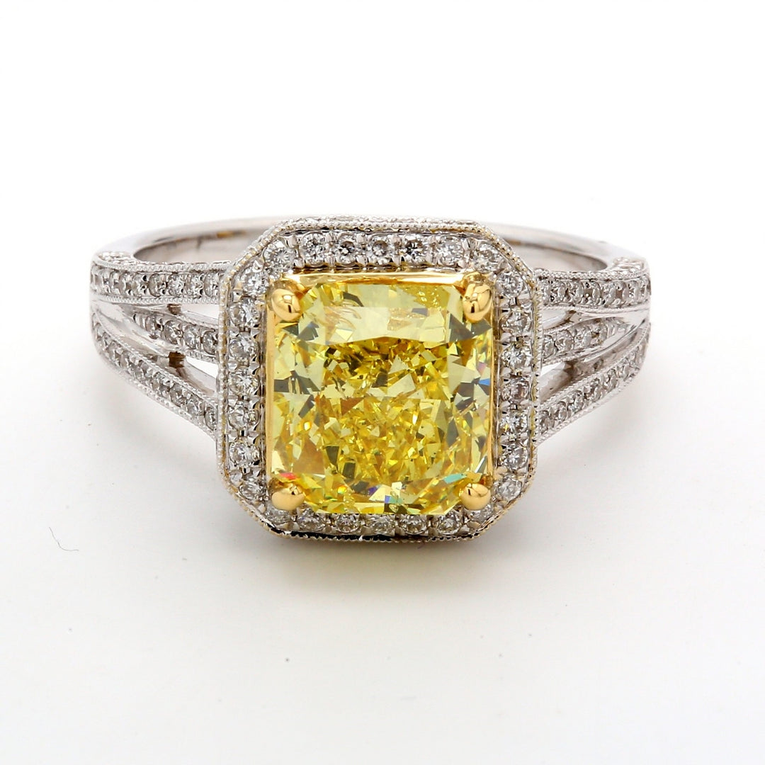 Halo ring in 18K WG w/ rounds around GIA certified FVY/I1 radiant cut diamond.  D3.47ct.t.w.  (Center - 2.79ct.)
