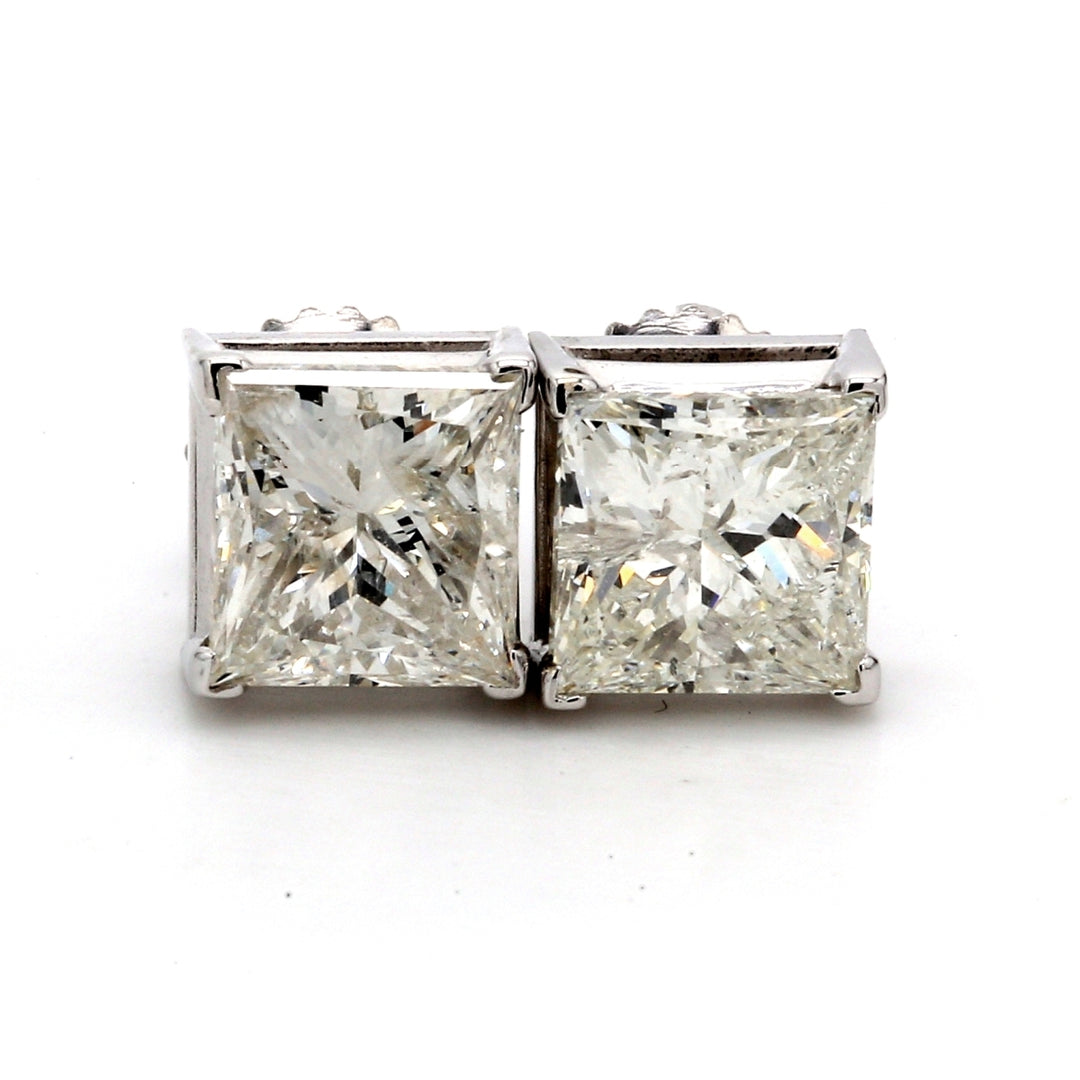 Screw back stud earrings with 4-prong set USA certified G/SI3 princess cut diamonds.  D3.12ct.t.w.